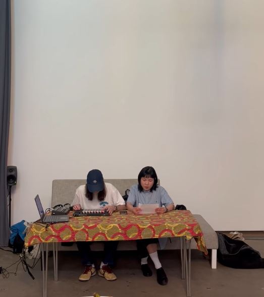 Ewan and collaborator at a live performance